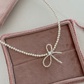 Elegant Zirconia Bow Knot Pearl Chain Necklace 6W6JNC431